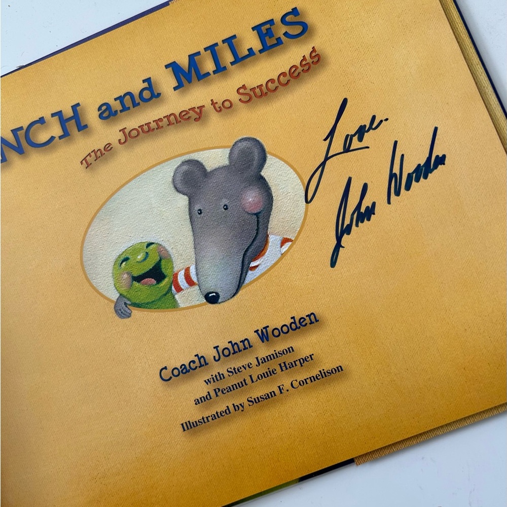 John Wooden signed copy of "Inch and Miles The Journey to Success" book.